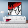Woman's painting with red hat and bow